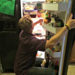 sexy husband cleaning the fridge