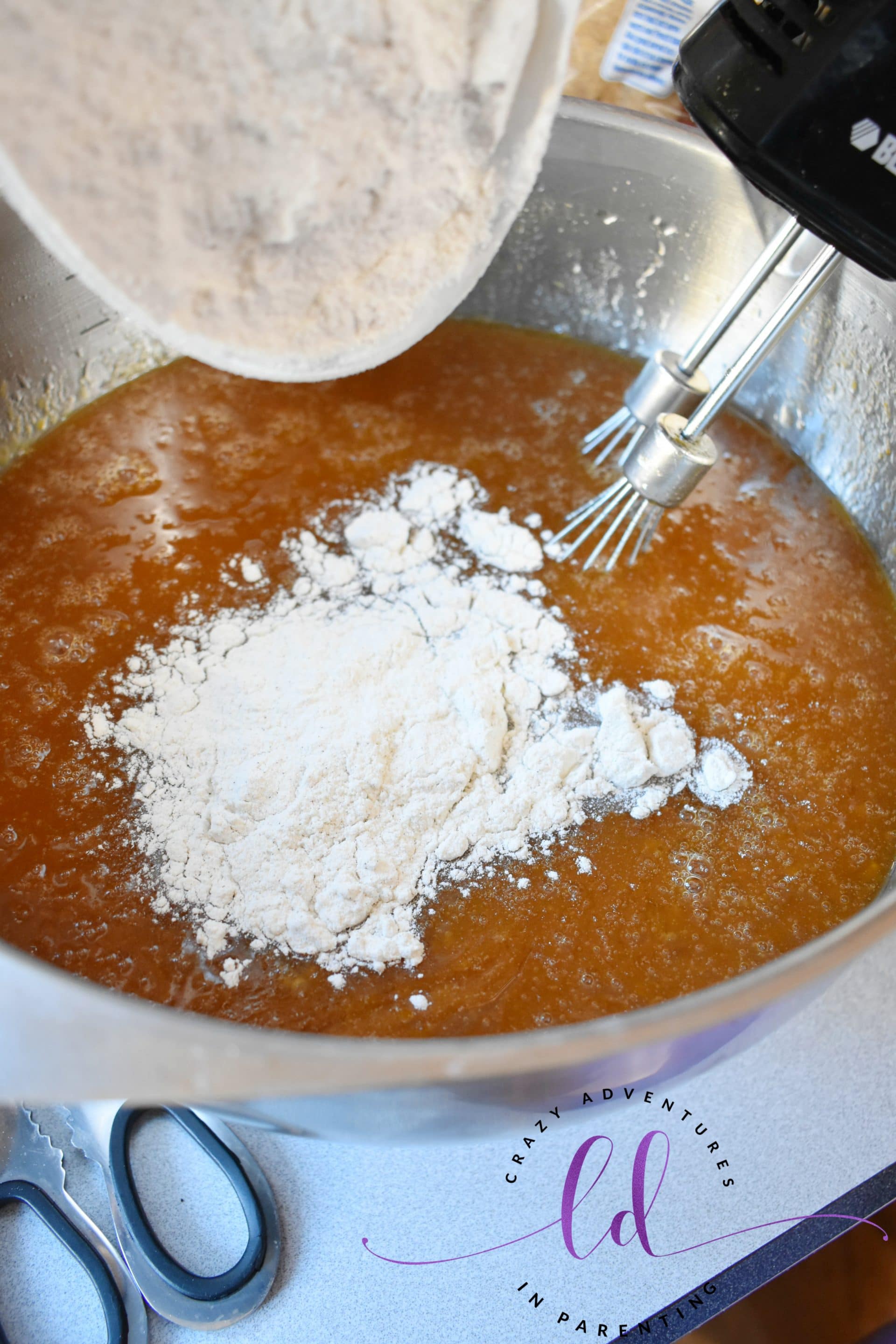 Add dry ingredients to wet ingredients for pumpkin bread