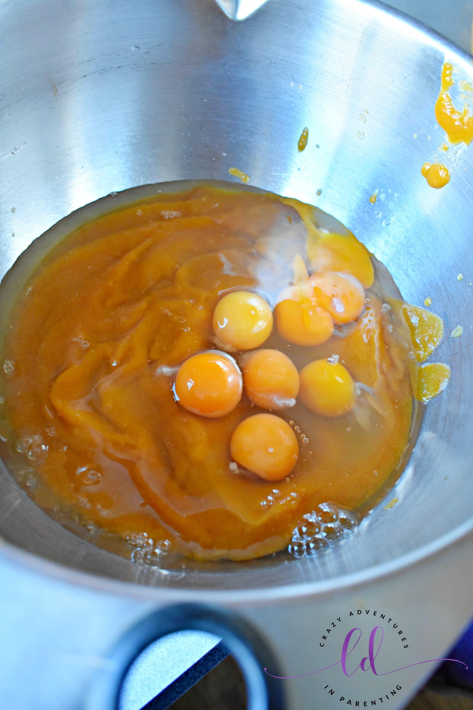 Add eggs to pumpkin puree for Maine Pumpkin Bread Recipe