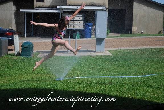 leaping in sprinkler