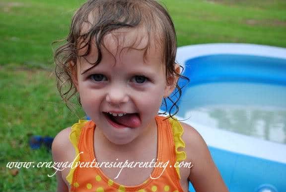 toddler sticking her tongue out