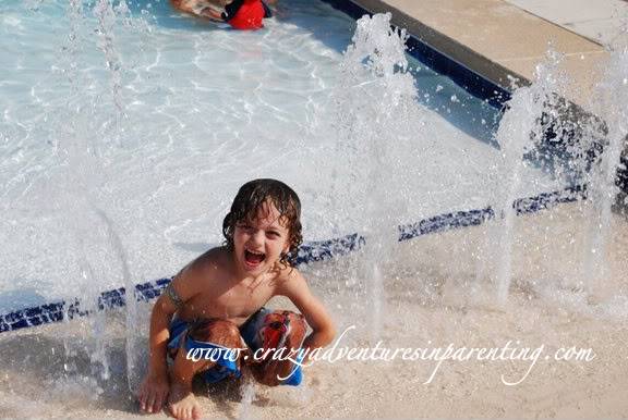 4-year-old sprinkler pool fun