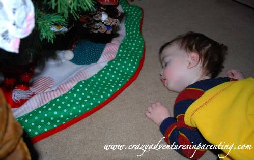 sleeping under the Christmas tree