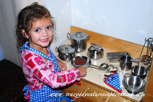 My daughter playing with All-Play Stainless Cookware Set from Constructive Playthings
