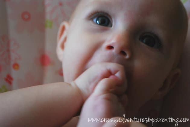baby v chewing on feet