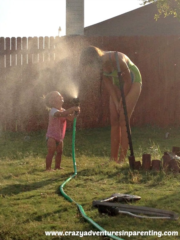 baby fun with sprinkler