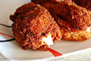 cheese oozing out of bacon wrapped jalapeno popper chicken