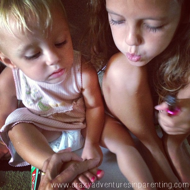 girl bonding over nail polish
