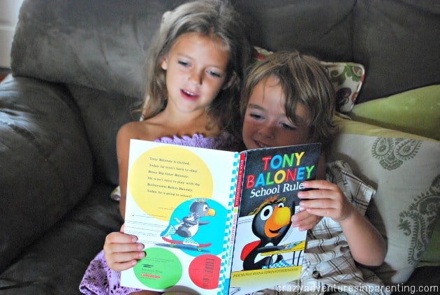 reading a book with her brother