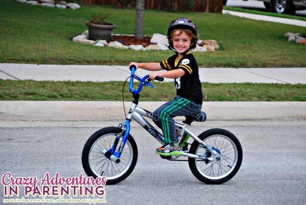 baby dude riding a two wheeler