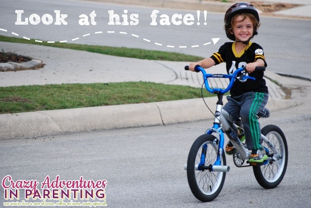 baby dude riding a two wheeler