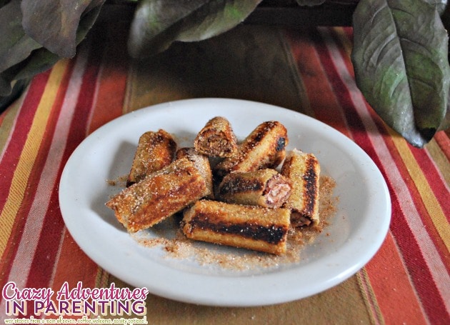 Nutella peanut butter cream cheese roll ups sprinkled with cinnamon sugar