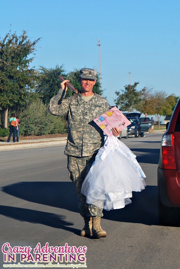 hot soldier carrying his daughter's princess dress
