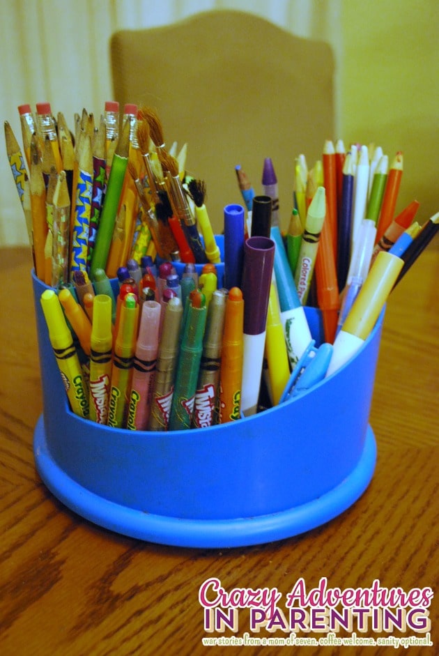 organized pens, pencils, crayons, and paint brushes