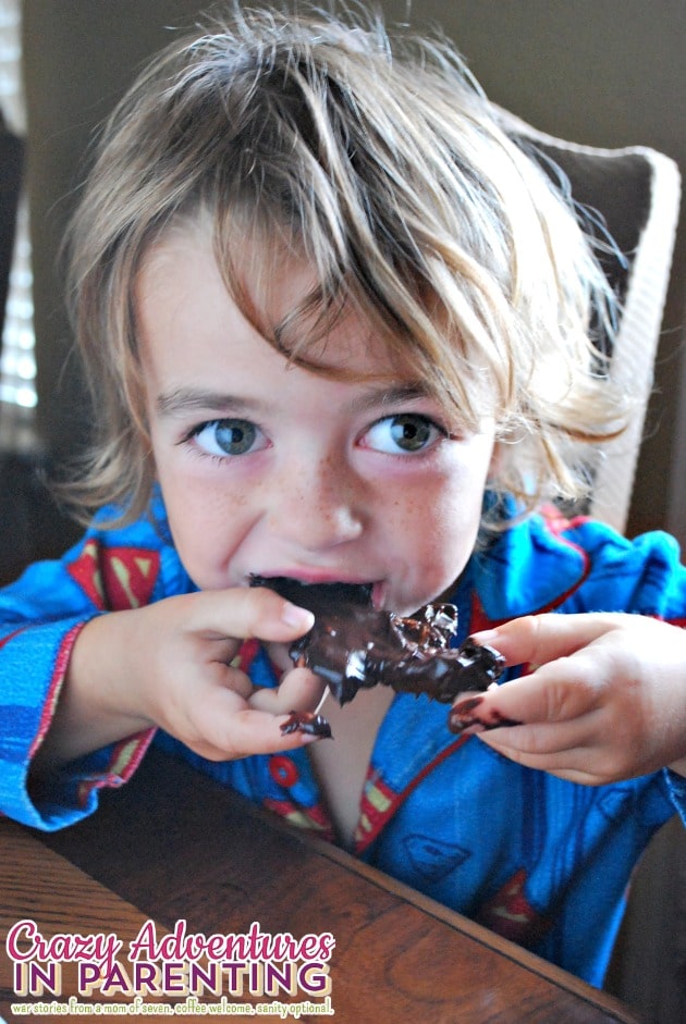 son eating Halloween waffles