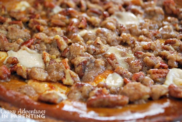 layered pumpkin pie cheesecake with pecan streusel