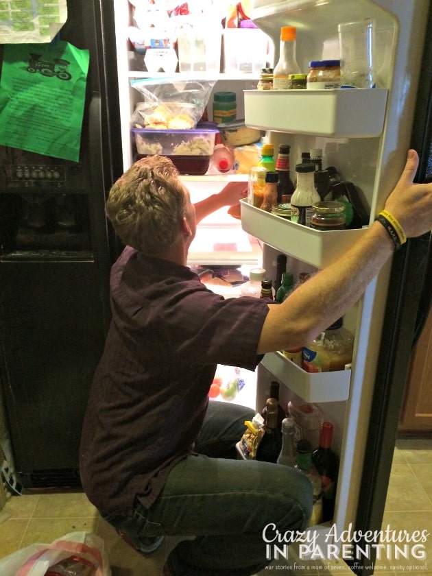 sexy husband cleaning the fridge