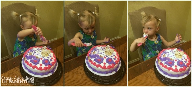 baby enjoying her smash cake