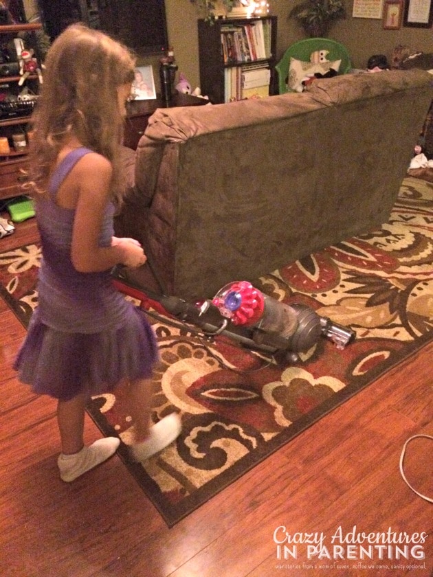 child vacuuming
