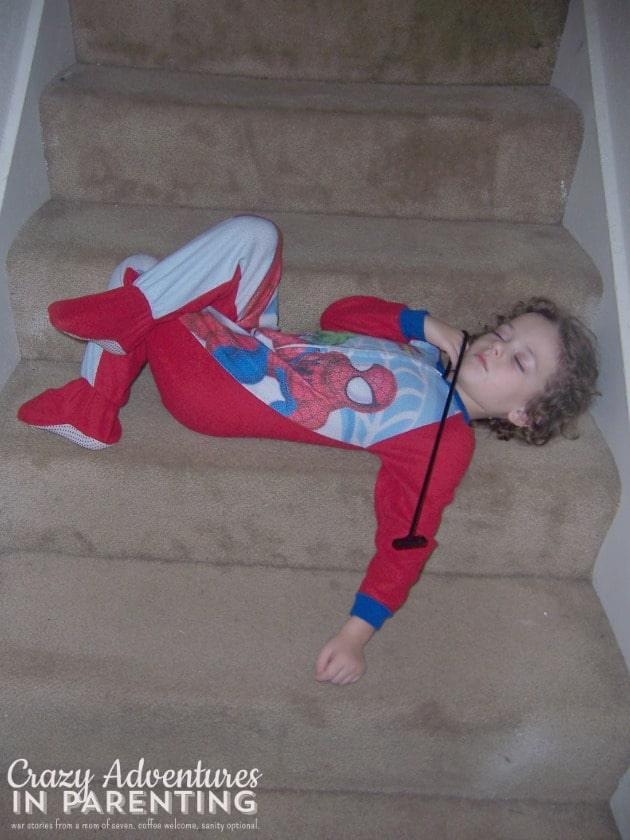 kid asleep on the stairs