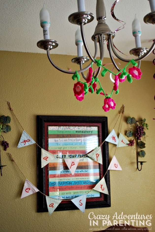 Flower garland hanging from chandelier