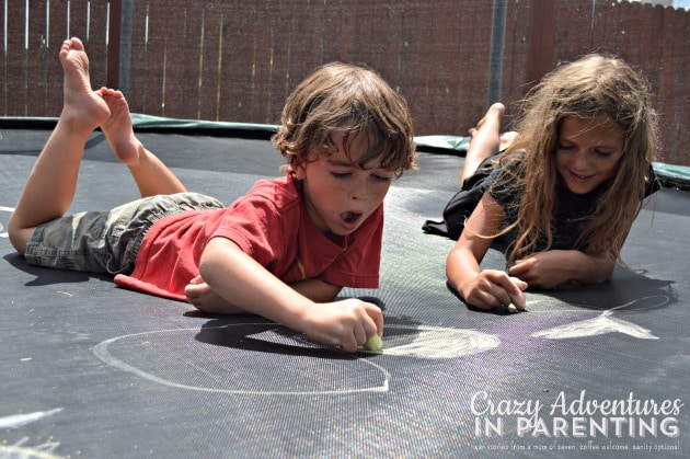 drawing with chalk on the trampoline