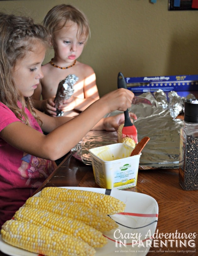 girls at work preparing corn on the cob