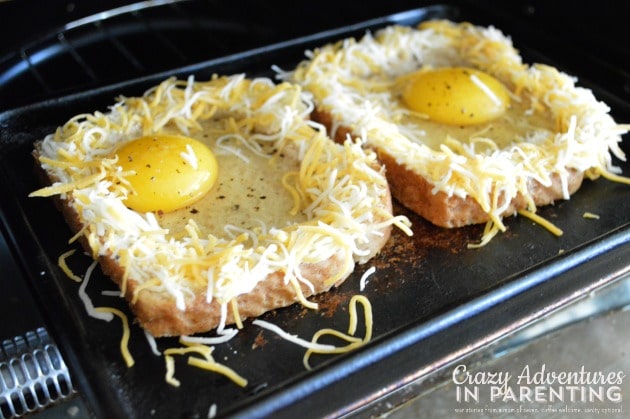 putting cheesy baked egg toast in toaster