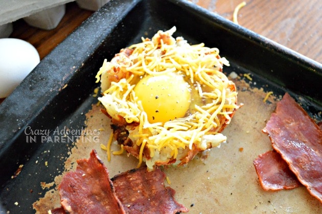 add cheese and season the Bacon Egg and Hash Brown Nests