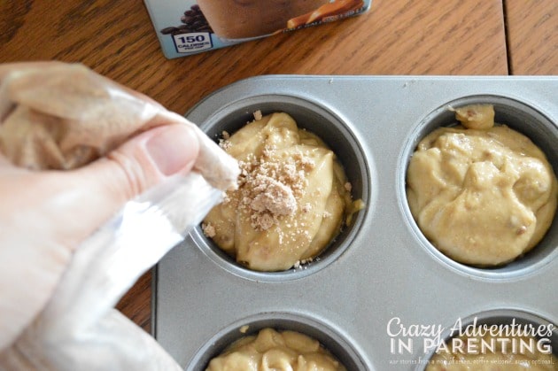 adding cinnamon streusel to muffins