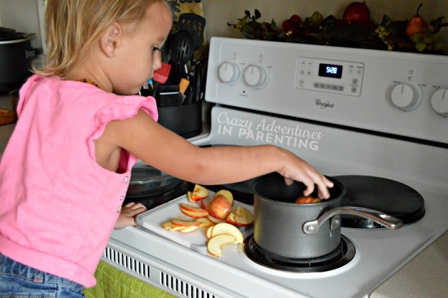 adding apple slices to the pot