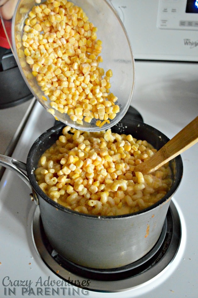 adding corn to sauce