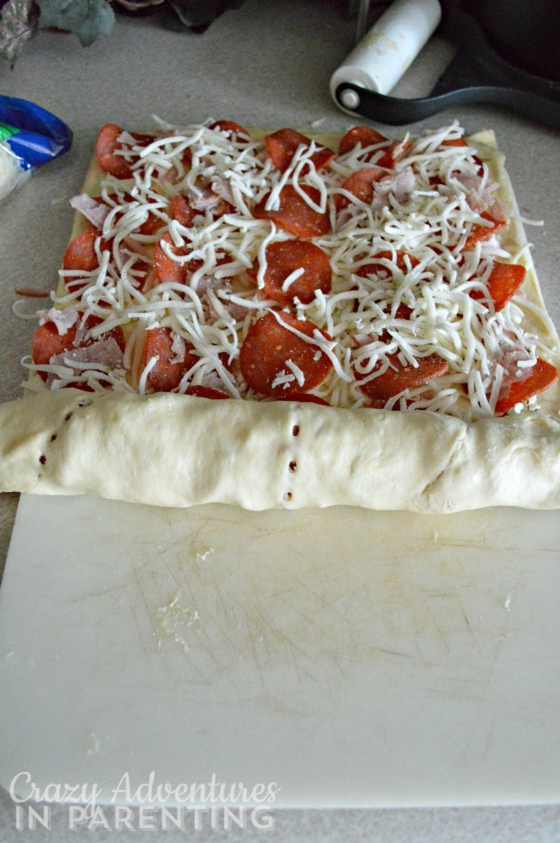 homemade pizza rolls being rolled