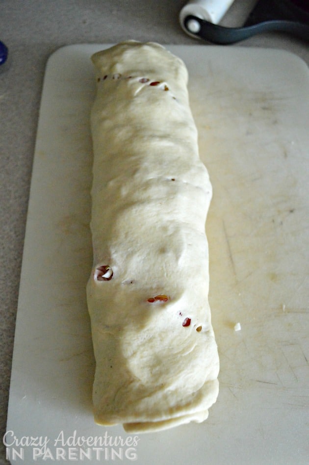 homemade pizza rolls rolled up ready to slice