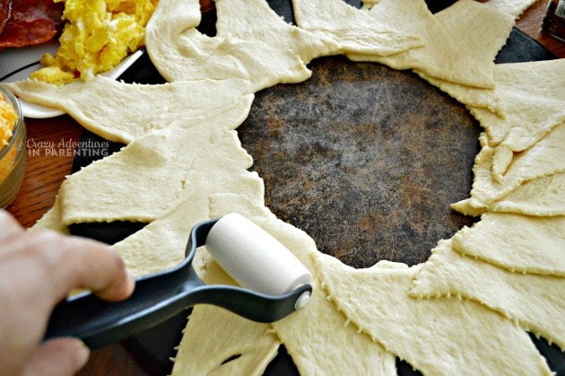 roll out dough for the Bacon Egg and Cheese Breakfast Ring