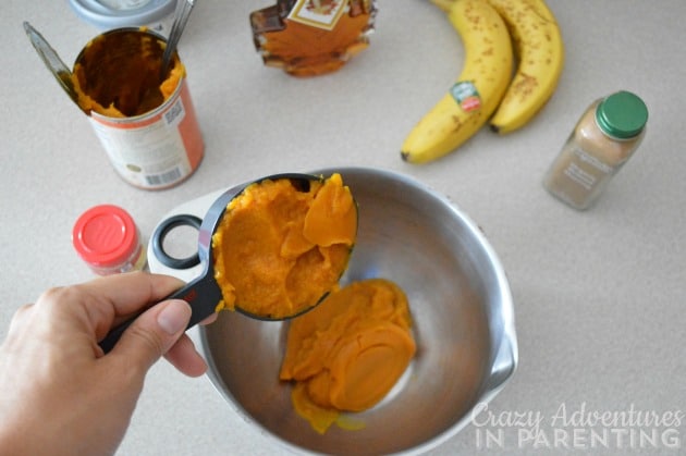 adding pumpkin into the bowl