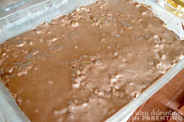 pour fudge over top crispy treats