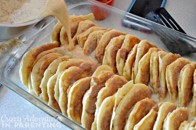 Cinnamon Roll Pancake Bake pouring buttermilk mixture into bake