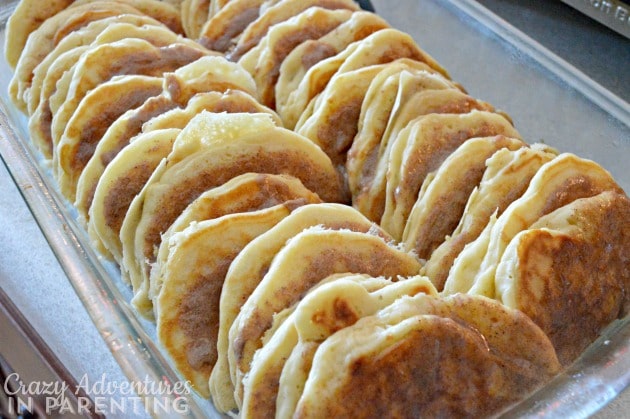 Cinnamon Roll Pancake Bake with cinnamon spread on the pancakes