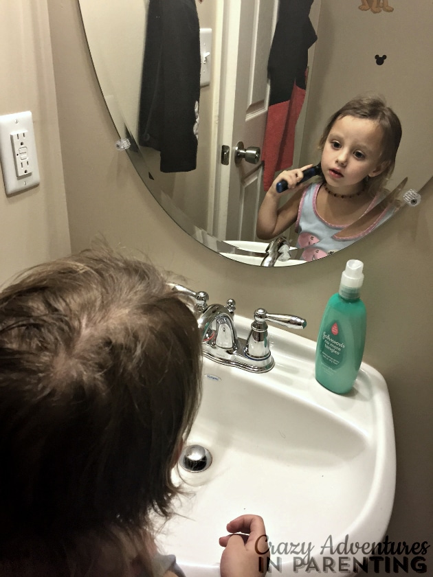 little sister doing her own hair