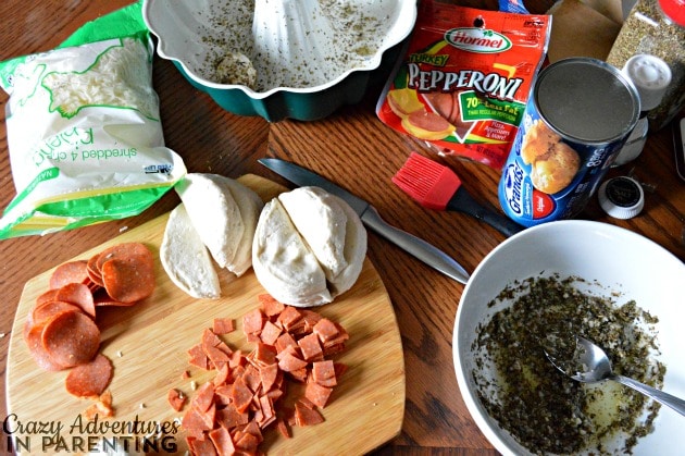 preparing ingredients for making easy garlic pull-apart pepperoni pizza monkey bread