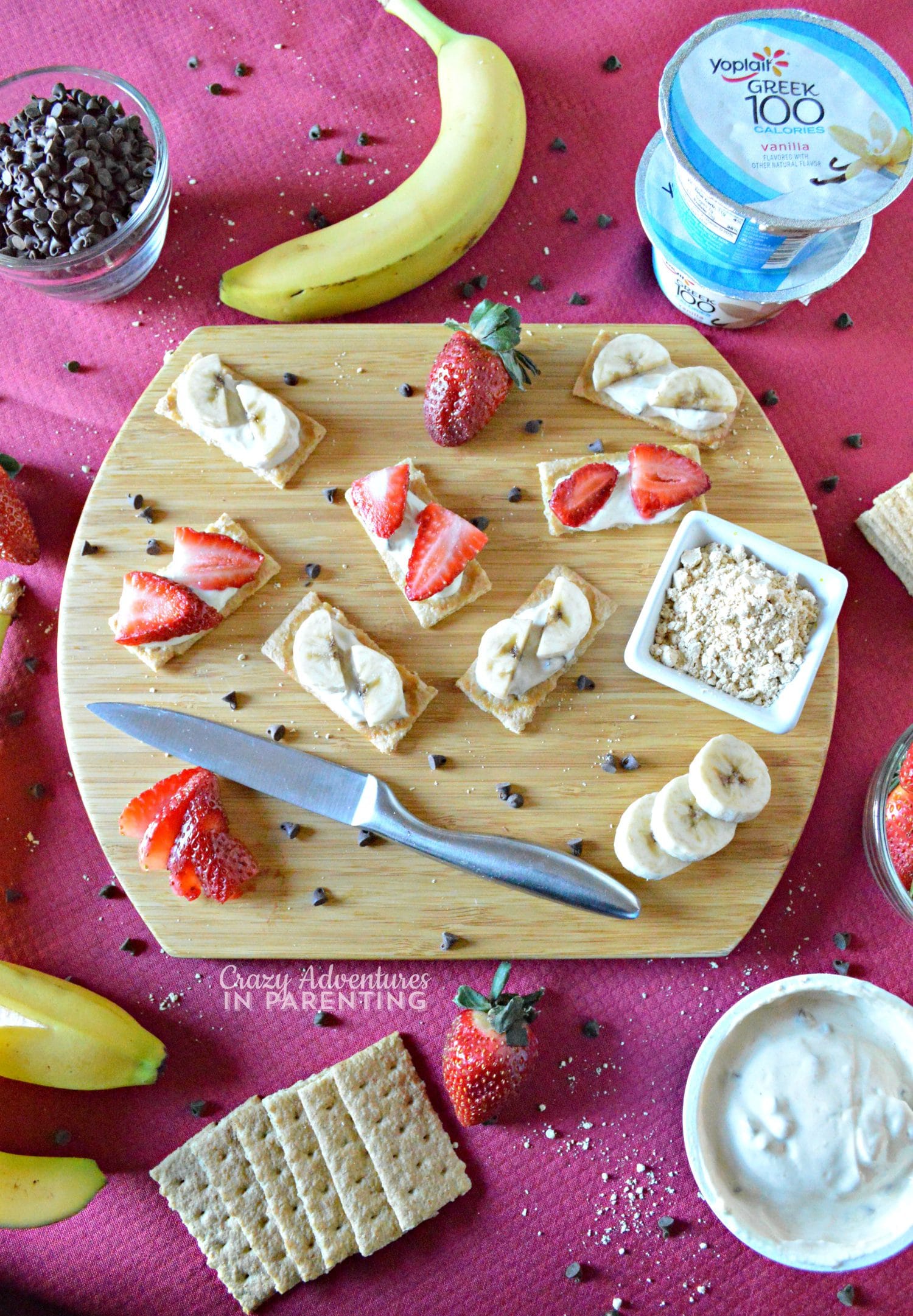 Protein-Packed Peanut Butter Chocolate Chip Yogurt Spread on Graham Crackers with Fruit Slices