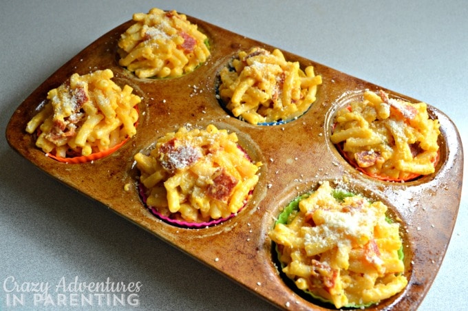 Mac and Cheese Pizza Muffins sprinkled with parmesan