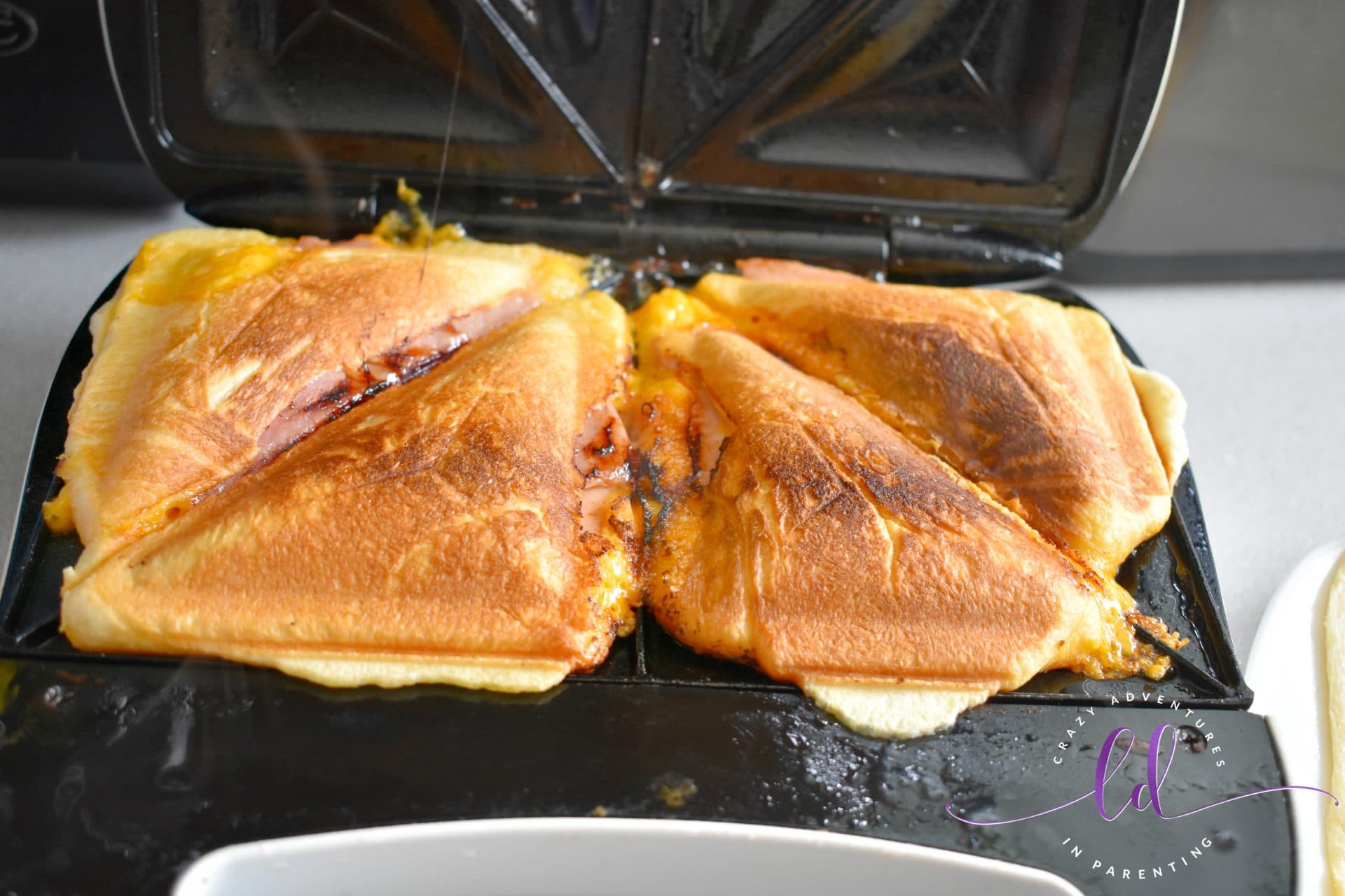 Ham and cheese crescent roll sandwich in sandwich maker