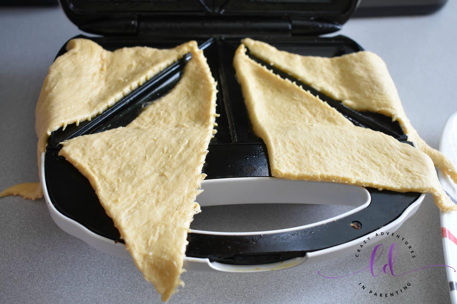 Lay crescent triangles in sandwich maker