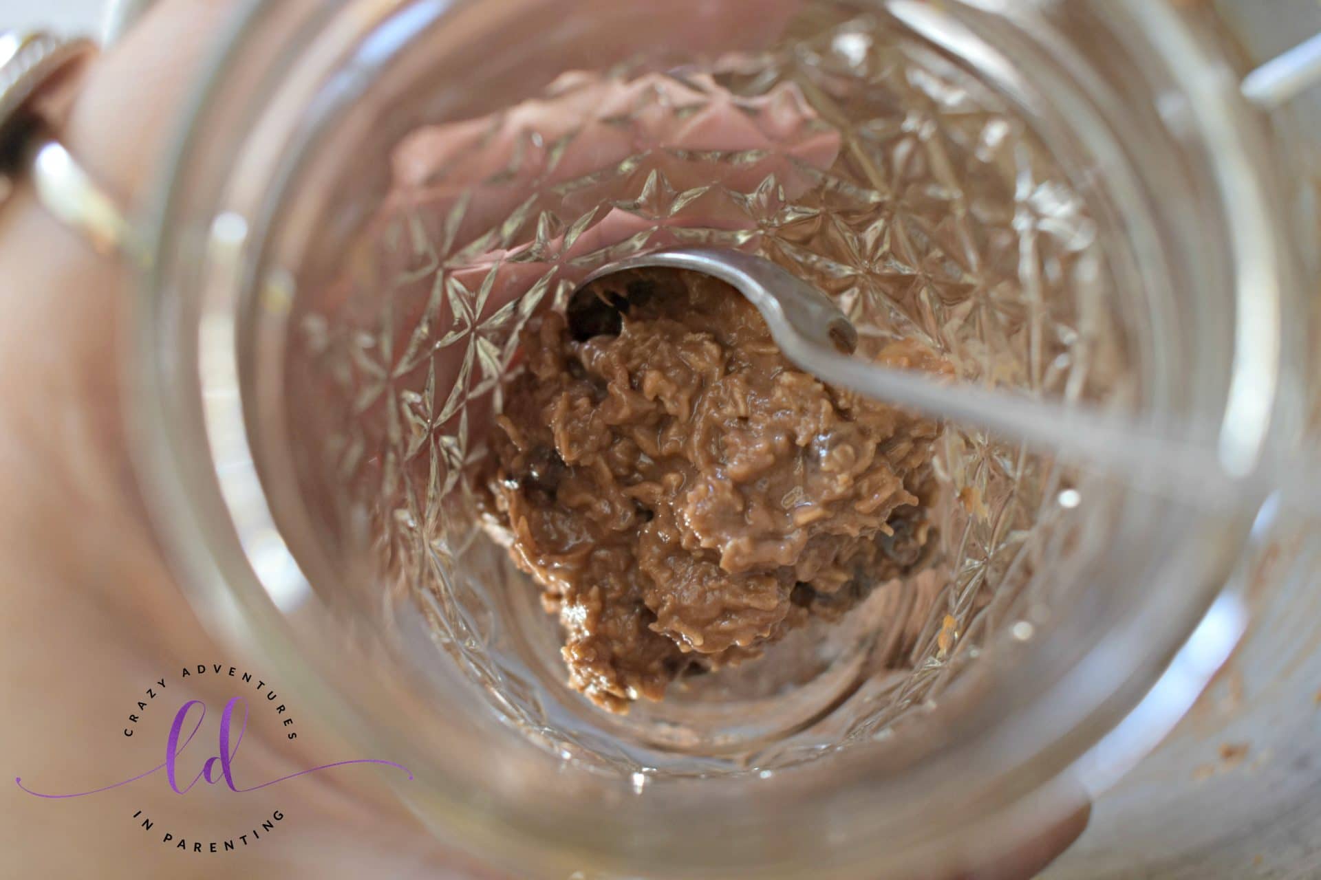 Adding Chocolate Peanut Butter Banana Overnight Oats to jars