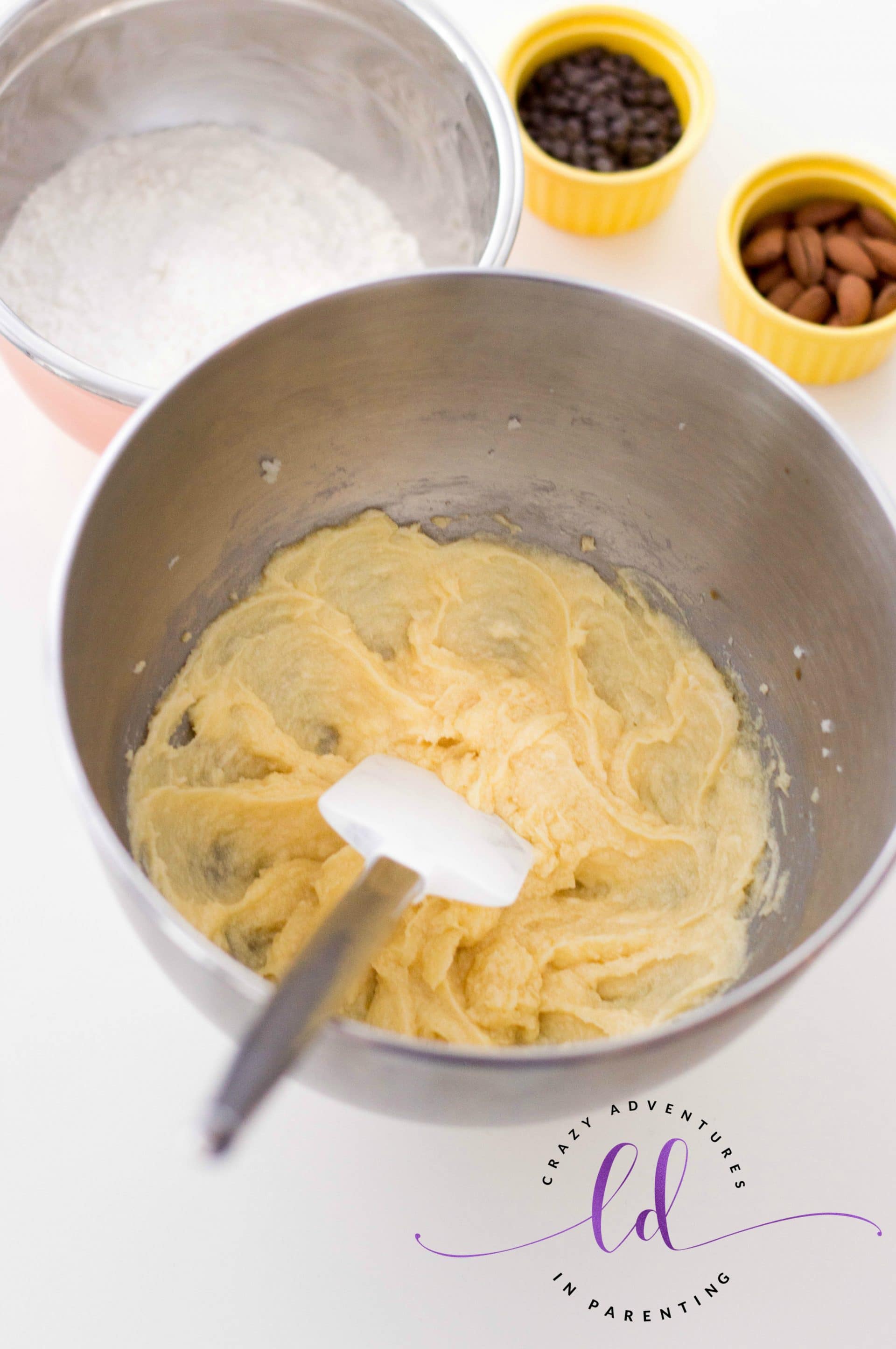 Add dry ingredients into Wet Ingredients for Chocolate Almond Thumbprint Cookies