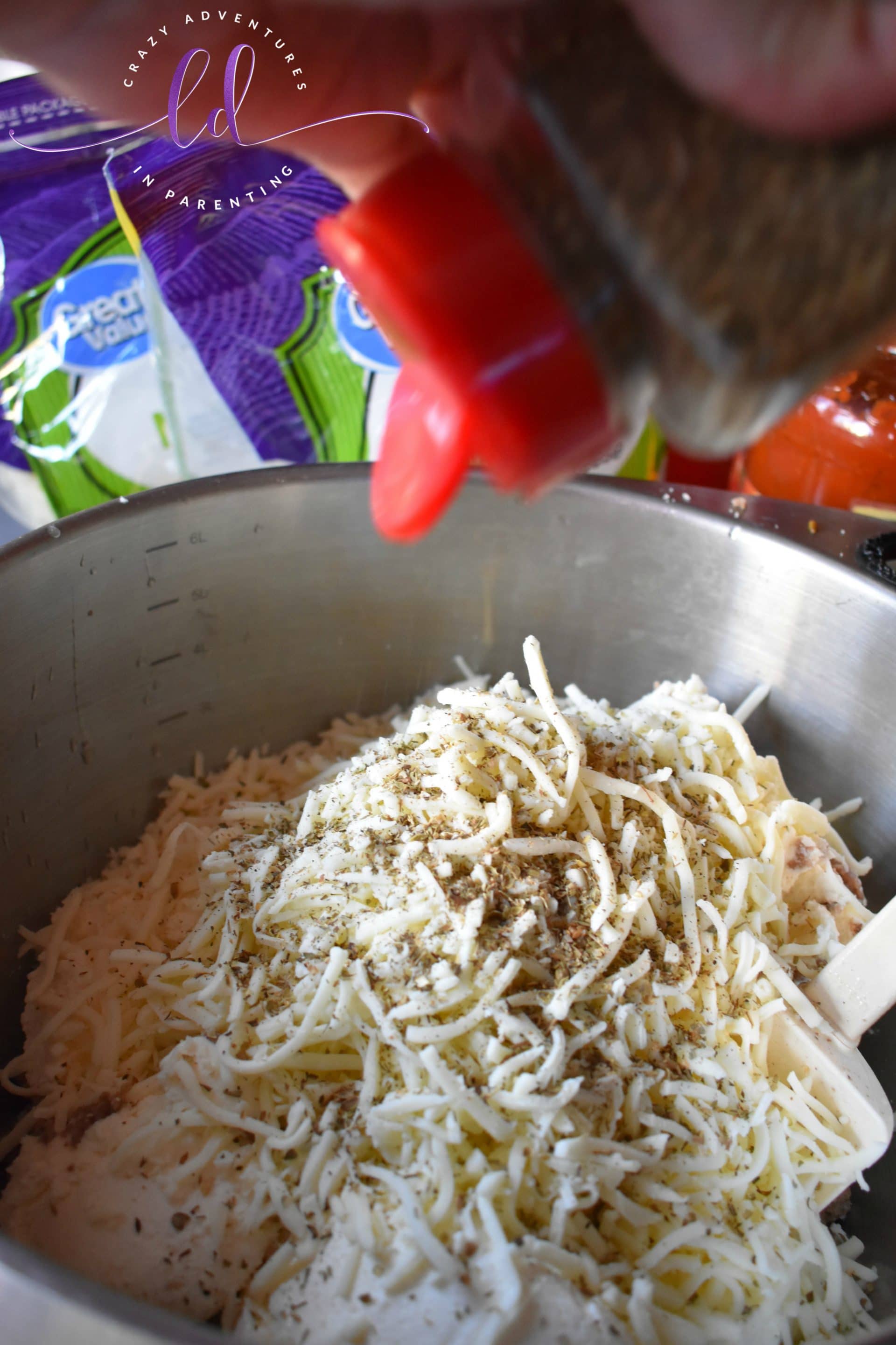 Add spices to meat cheese mixture for homemade lasagna