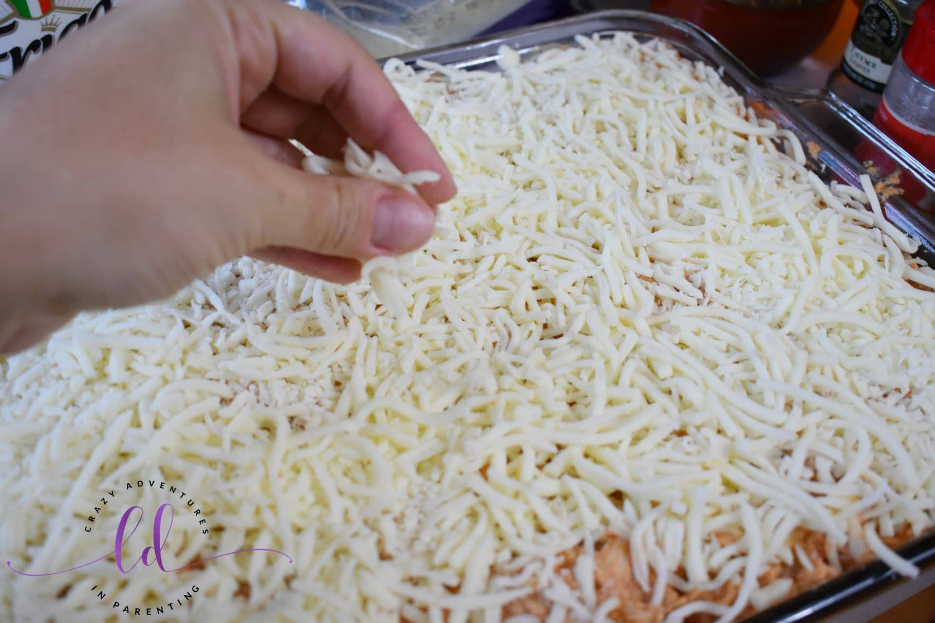 Sprinkle mozzarella on top of the homemade lasagna