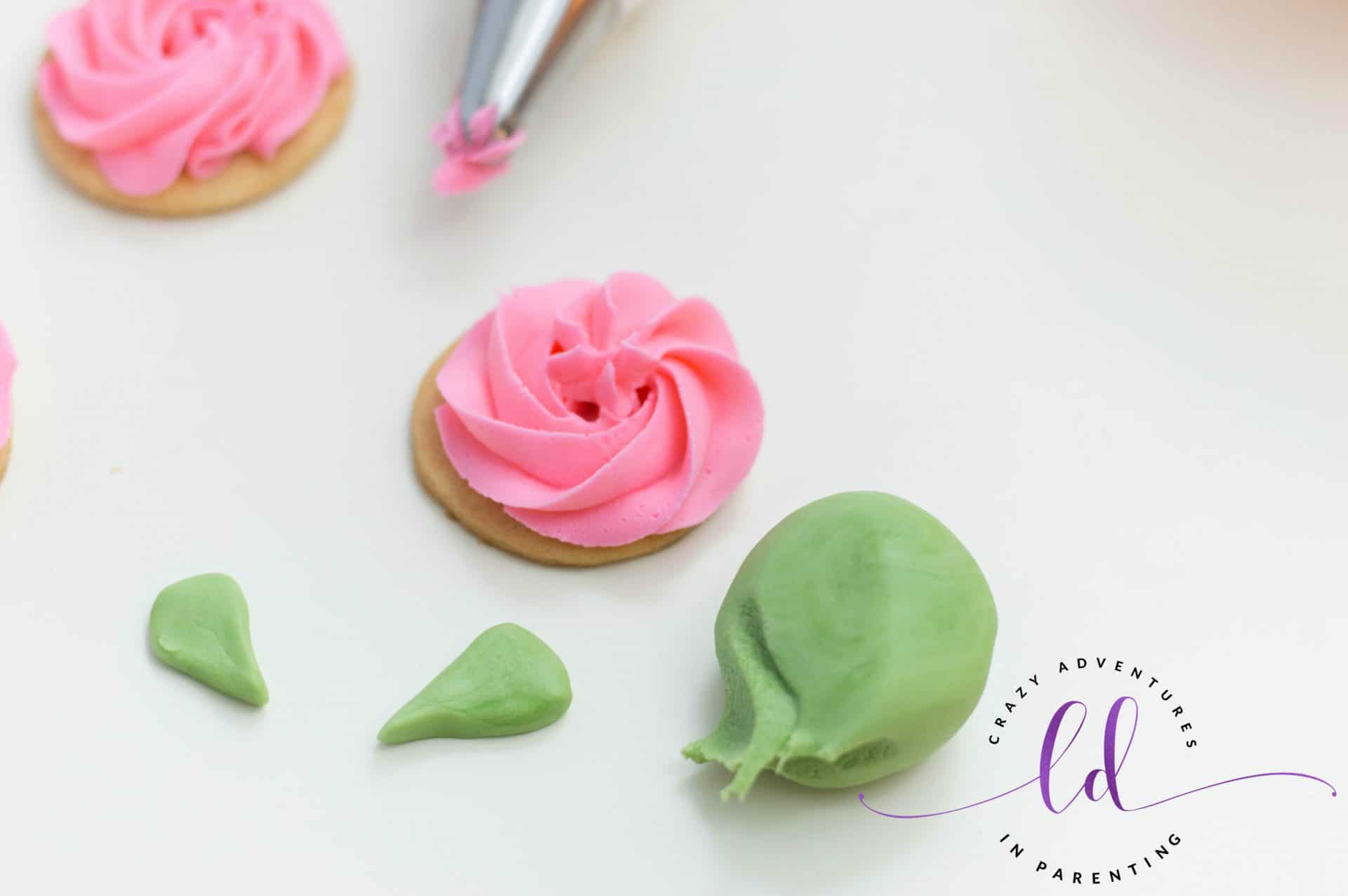 Create leaf shapes from green fondant for Rose Sugar Cookies